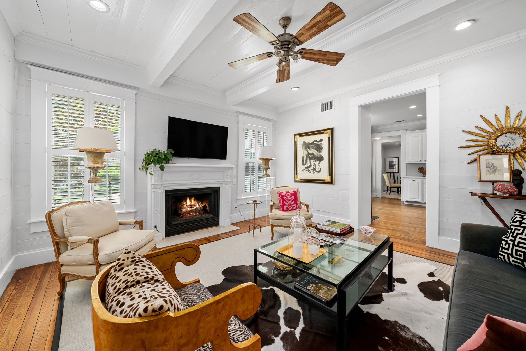 722 Jackson Street Columbus, TX 78934 - Photo 11 of 45 a living room with furniture a flat screen tv and a fireplace