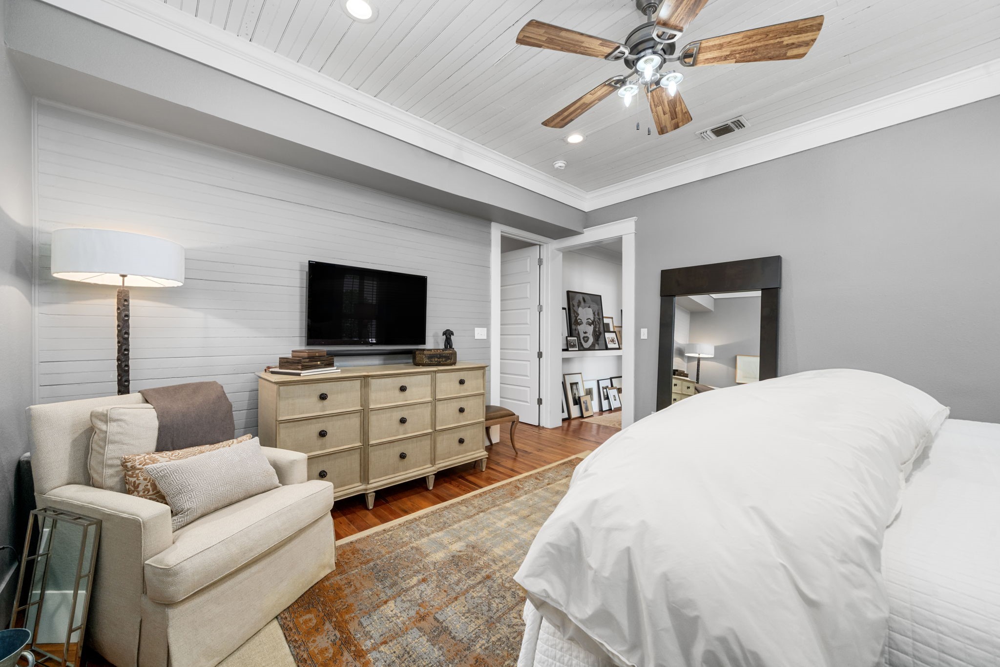 722 Jackson Street Columbus, TX 78934 - Photo 25 of 45 a bedroom with furniture and a flat screen tv