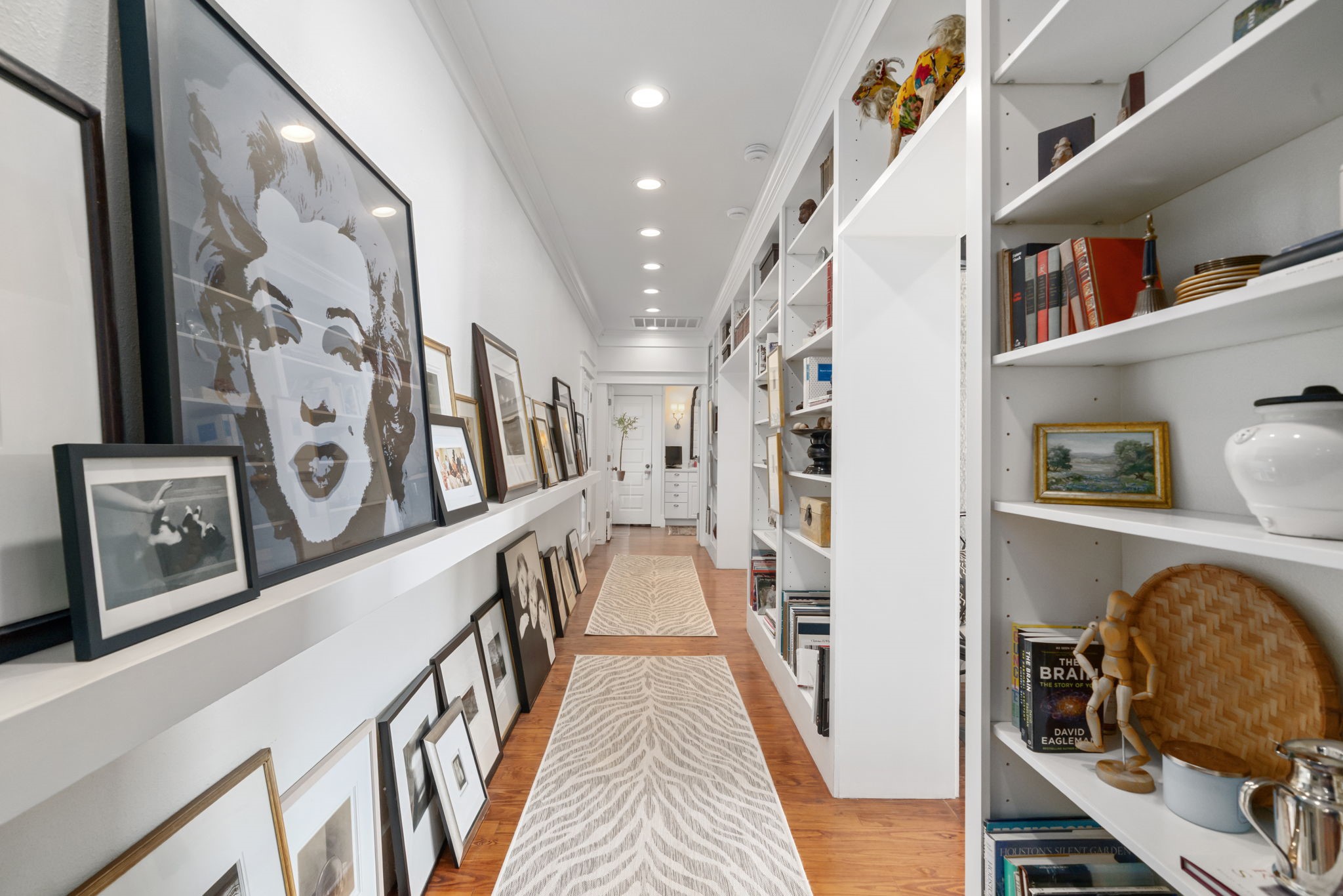 722 Jackson Street Columbus, TX 78934 - Photo 28 of 45 a view of a hallway with wooden floor and staircase