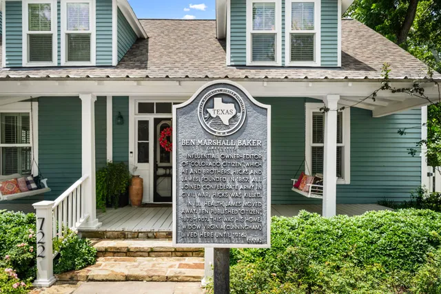 front view of a building with a garden