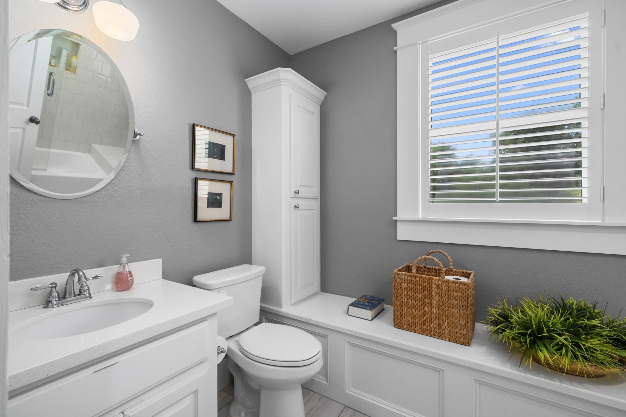 722 Jackson Street Columbus, TX 78934 - Photo 36 of 45 a bathroom with a granite countertop toilet sink and mirror