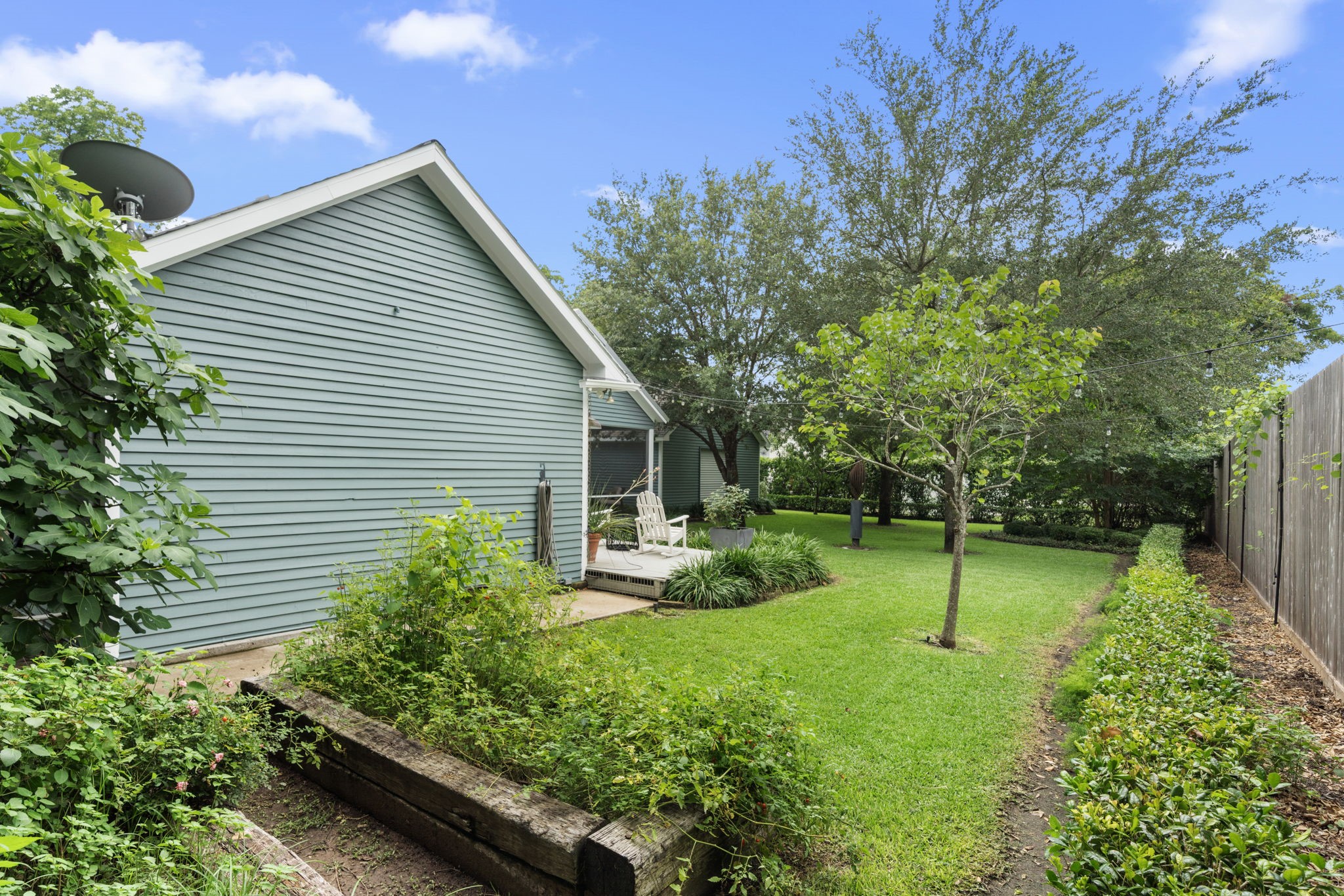722 Jackson Street Columbus, TX 78934 - Photo 44 of 45 a backyard of a house with plants and tree