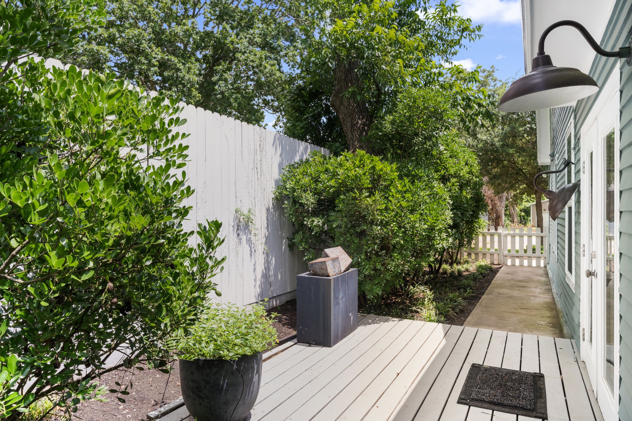 722 Jackson Street Columbus, TX 78934 - Photo 45 of 45 a wooden bench sitting in front of a house