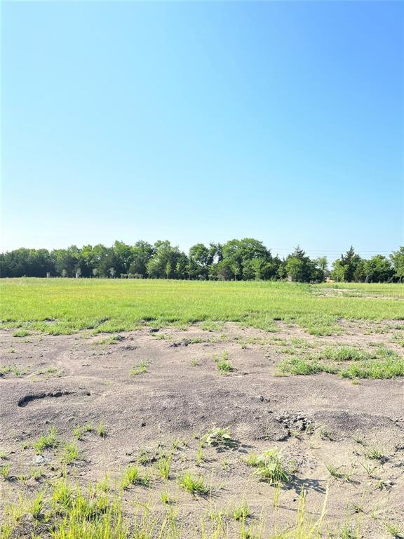 a view of a lake with beach and outdoor space