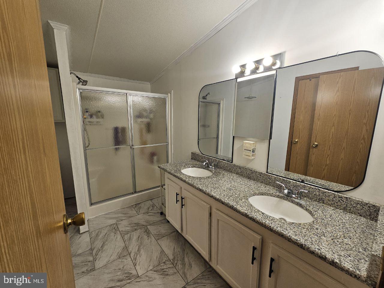 2304 Brownsville Road, Unit L22 Feasterville-Trevose, PA 19053 - Photo 12 of 22 a bathroom with a granite countertop sink mirror and double