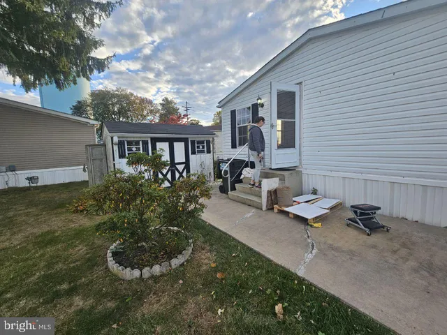 a front view of house with yard and outdoor seating