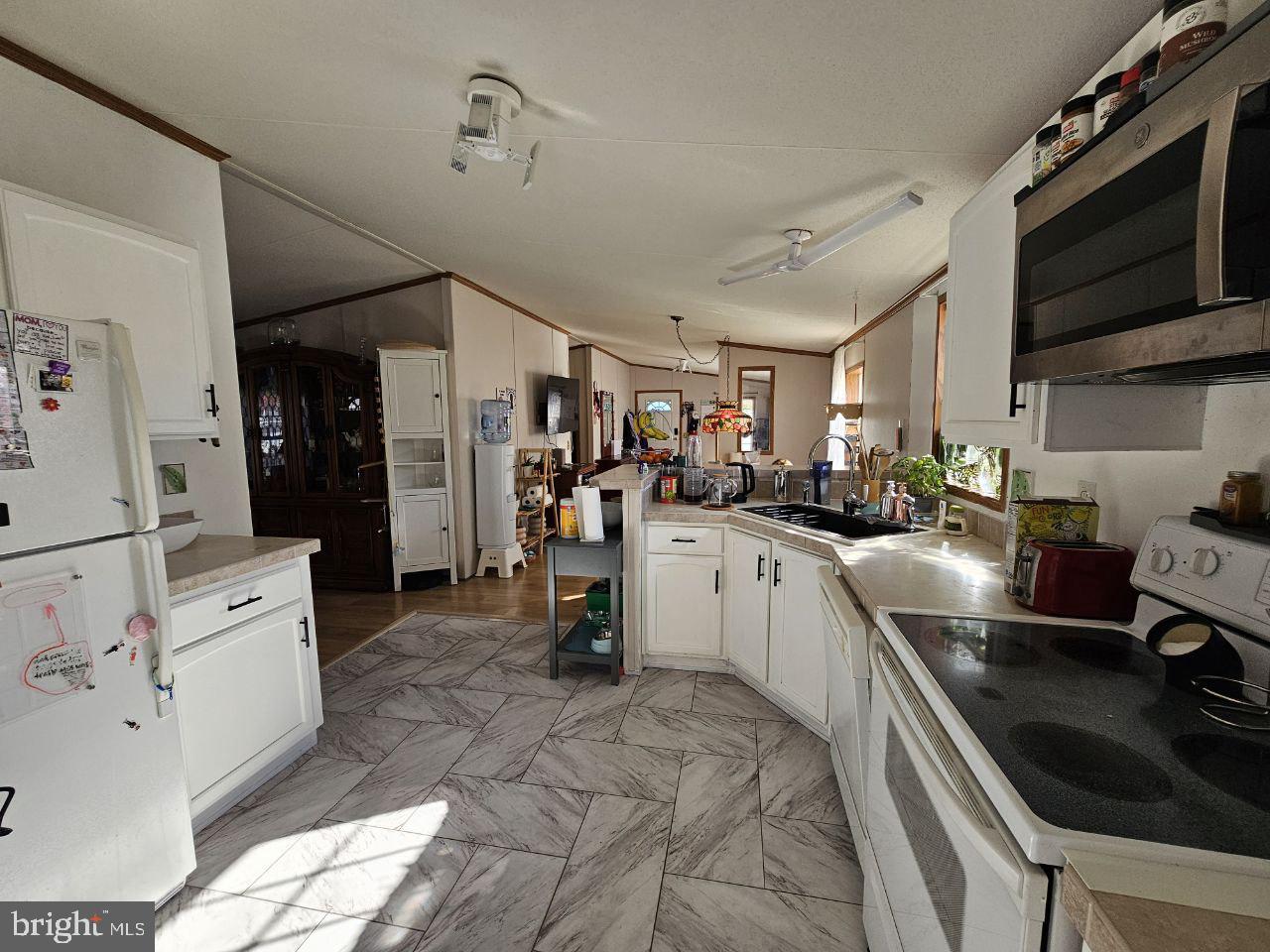 2304 Brownsville Road, Unit L22 Feasterville-Trevose, PA 19053 - Photo 4 of 22 a kitchen with granite countertop a sink appliances and cabinets