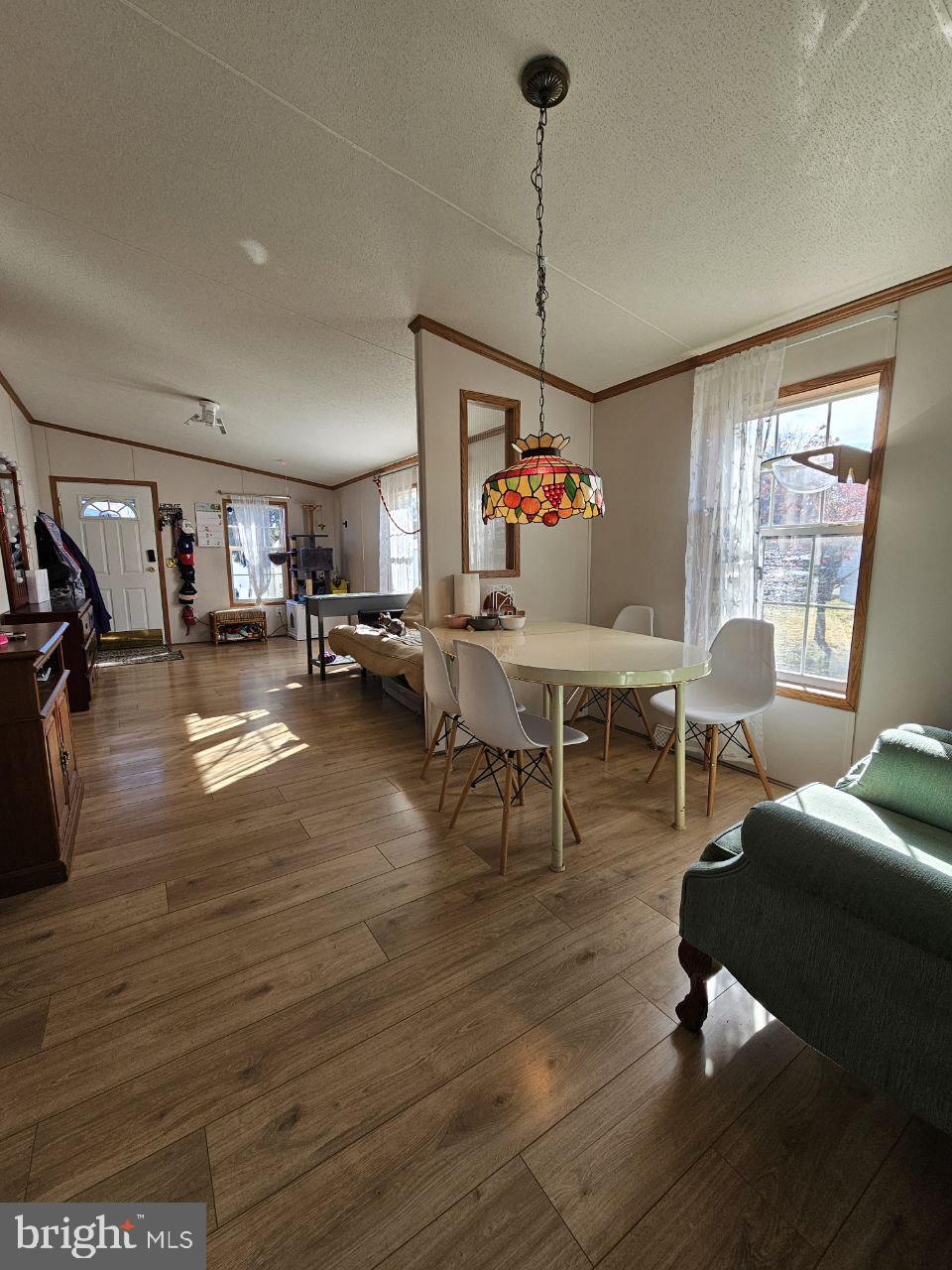 2304 Brownsville Road, Unit L22 Feasterville-Trevose, PA 19053 - Photo 6 of 22 a living room with furniture and a chandelier