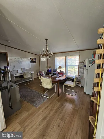 a living room with furniture a window and a flat screen tv