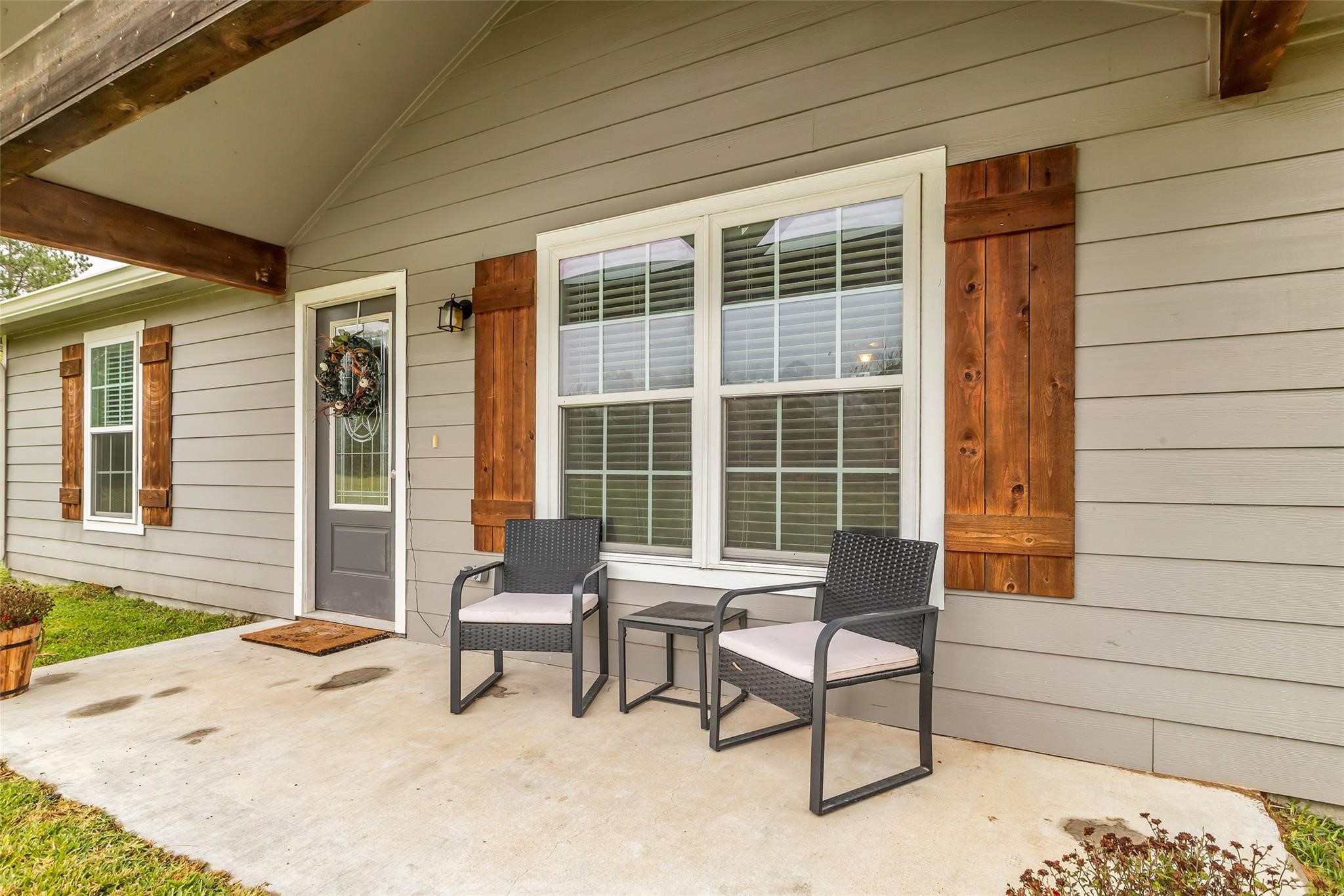 696 Independence Road Shepherd, TX 77371 - Photo 2 of 27 a house outdoor space with a couch