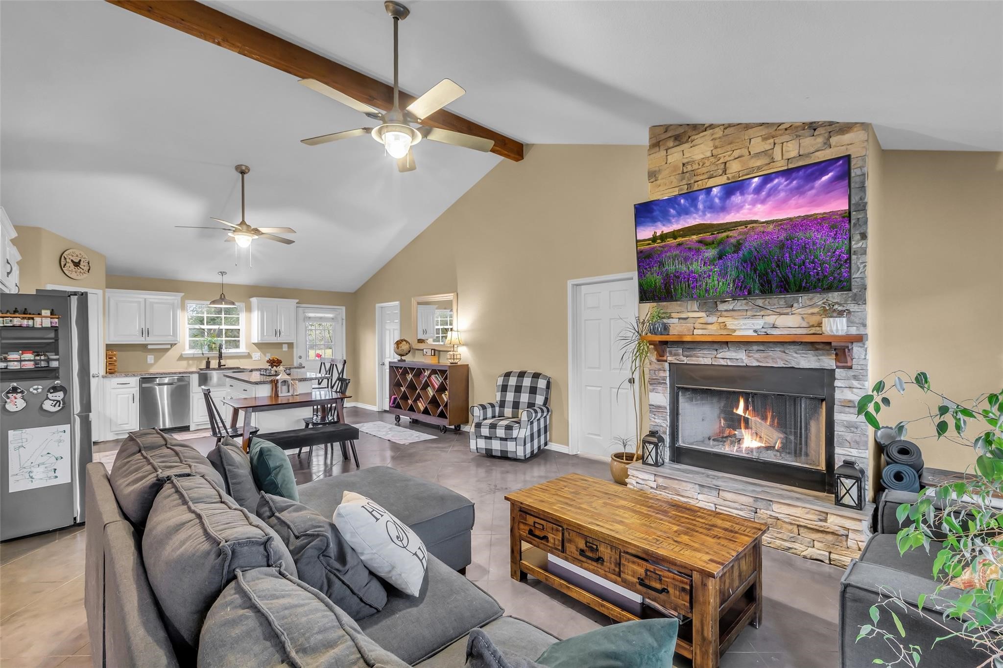 696 Independence Road Shepherd, TX 77371 - Photo 3 of 27 a living room with furniture a flat screen tv and a fireplace