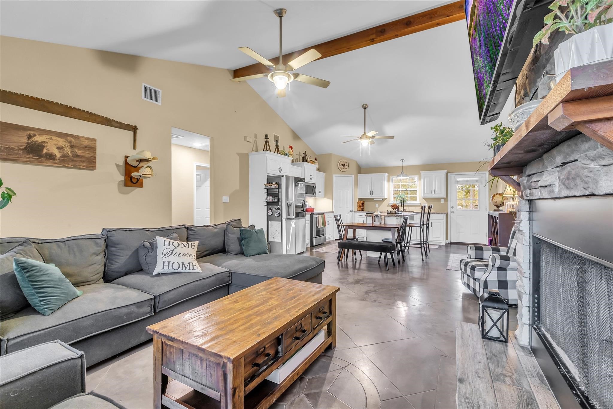 696 Independence Road Shepherd, TX 77371 - Photo 4 of 27 a living room with furniture and a chandelier