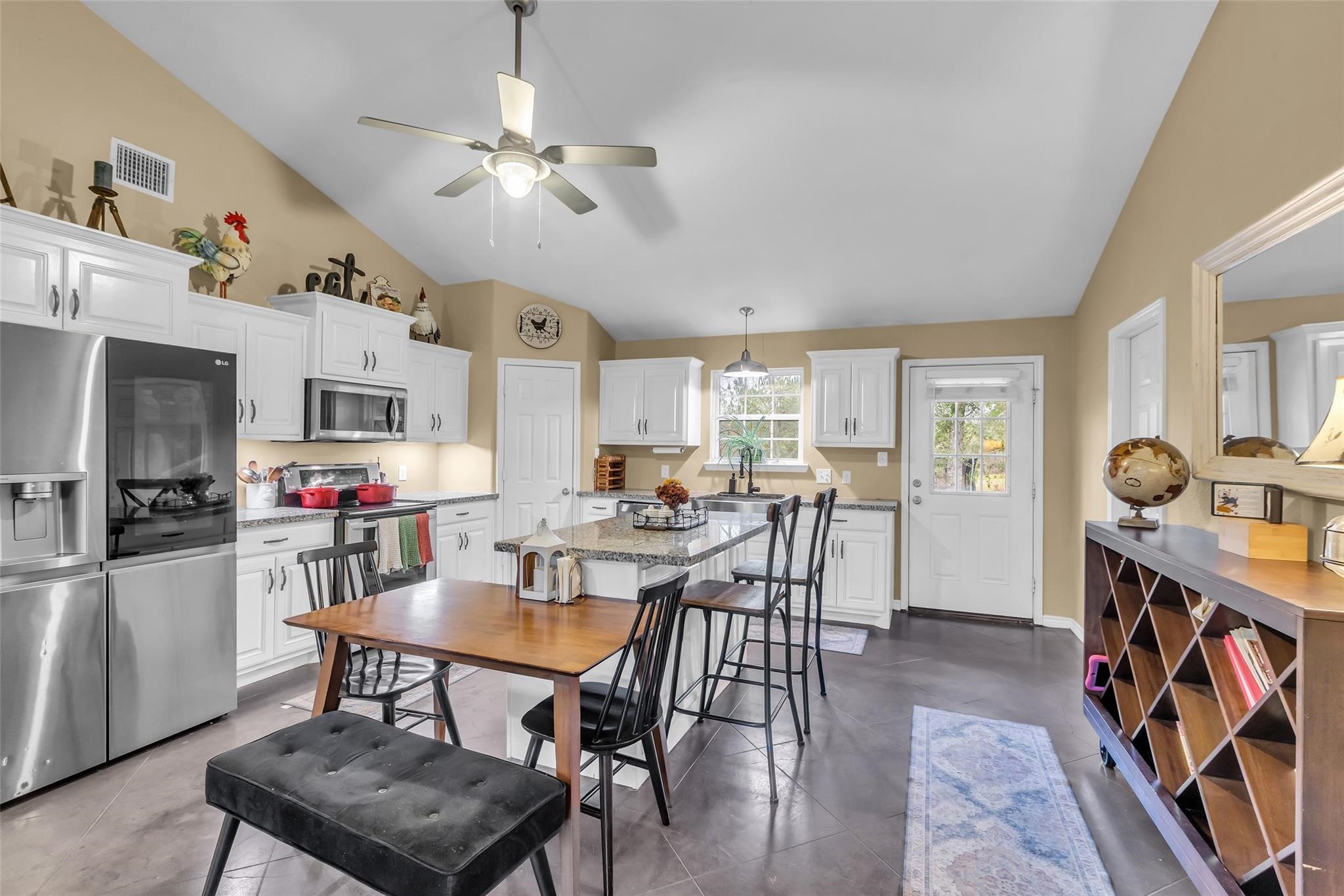696 Independence Road Shepherd, TX 77371 - Photo 8 of 27 a view of a dining room with furniture and a kitchen