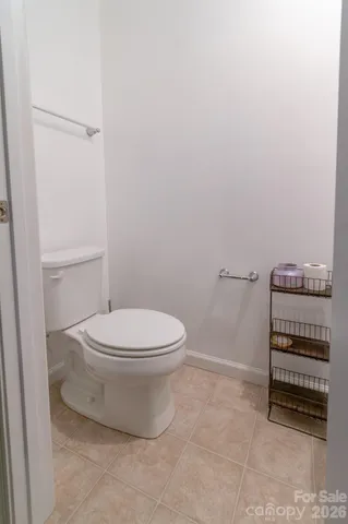 a bathroom with a toilet a sink and a vanity