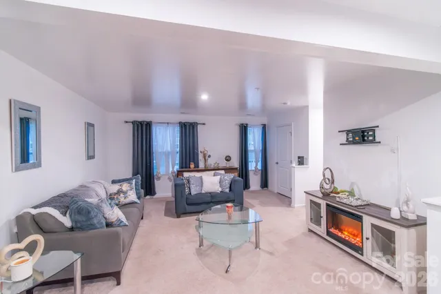 a living room with furniture and a table