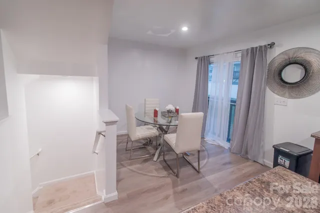 a view of a livingroom and chairs in a room