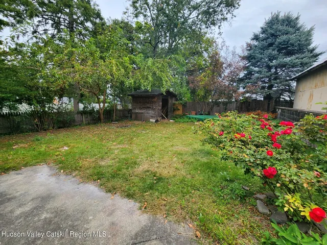 a fire hydrant in the middle of a yard