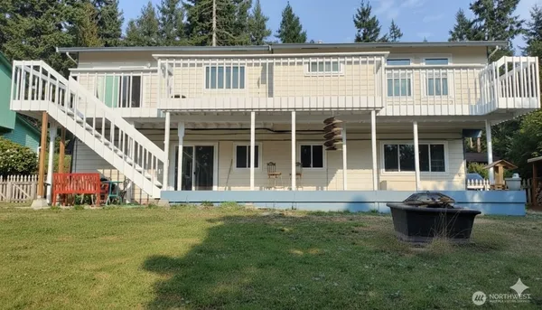 a view of a house with pool and garden