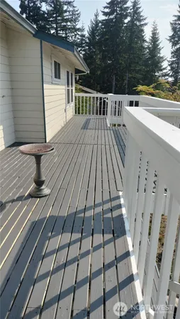 a view of a balcony with wooden floor