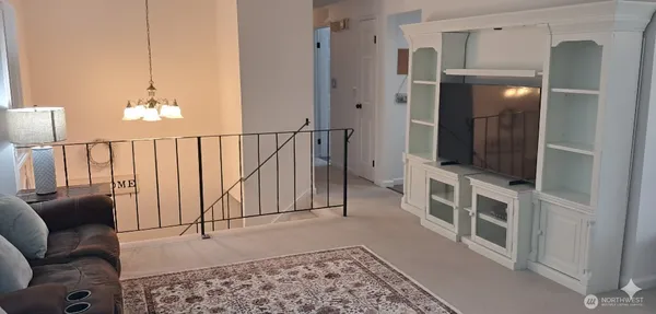 a view of a livingroom with furniture