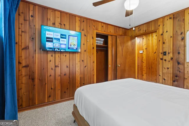 a bedroom with a bed and window