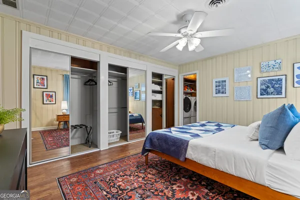 a bedroom with furniture and window
