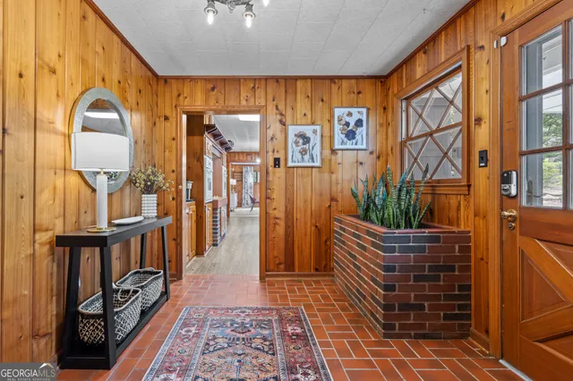 a view of entryway with wooden floor and furniture
