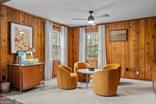 a living room with furniture and large window