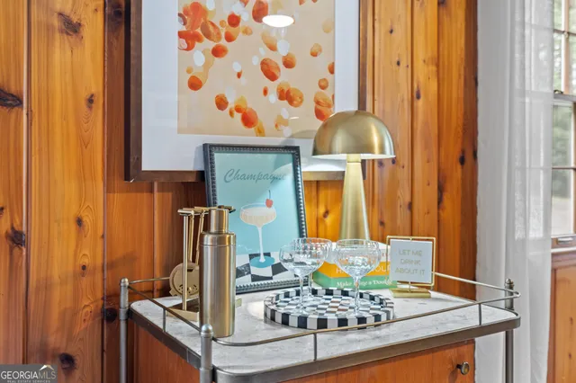 a living room with fireplace furniture and a book shelf