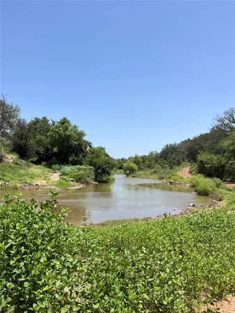 a view of a lake from a yard