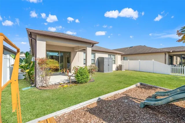 a view of a house with a yard porch and sitting area