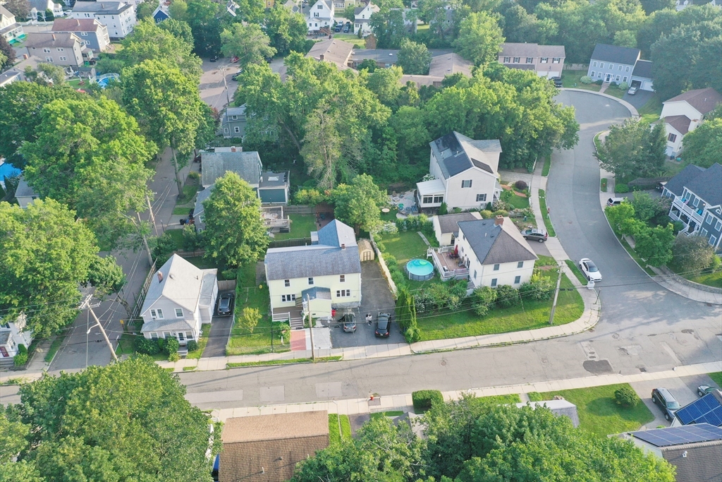 68 Maple Street Melrose, MA 02176 - Photo 2 of 39 an aerial view of a house with a garden and plants