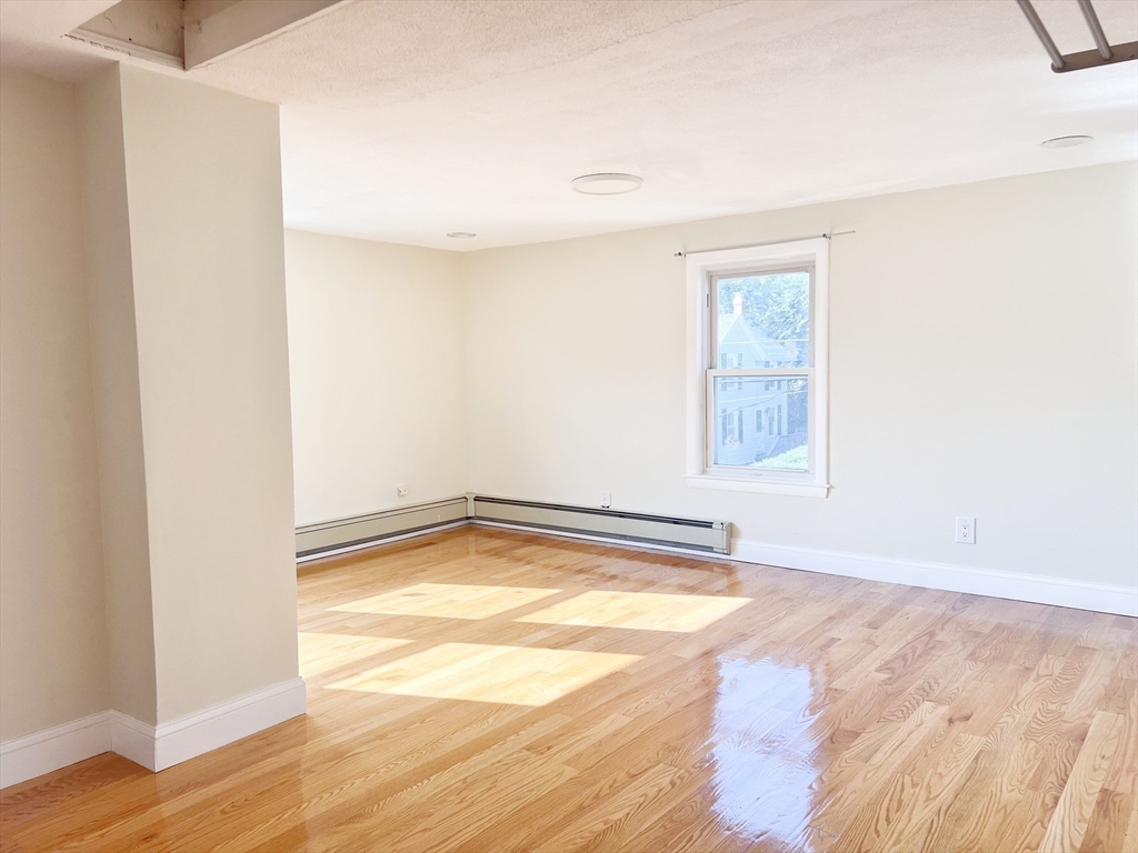 68 Maple Street Melrose, MA 02176 - Photo 21 of 39 a view of a kitchen with wooden floor and a sink