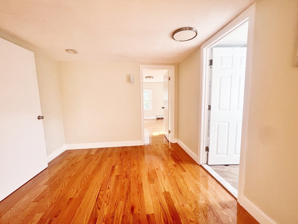 68 Maple Street Melrose, MA 02176 - Photo 25 of 39 a view of a room with wooden floor and small space