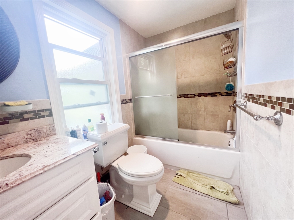 68 Maple Street Melrose, MA 02176 - Photo 30 of 39 a bathroom with a sink toilet and shower