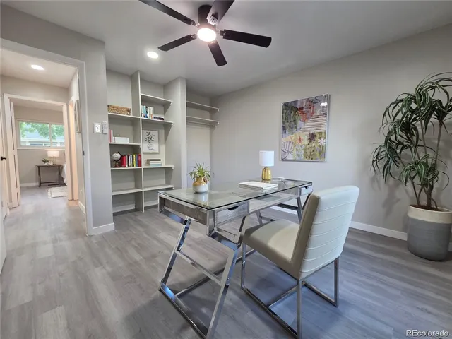 a workspace with furniture and wooden floor