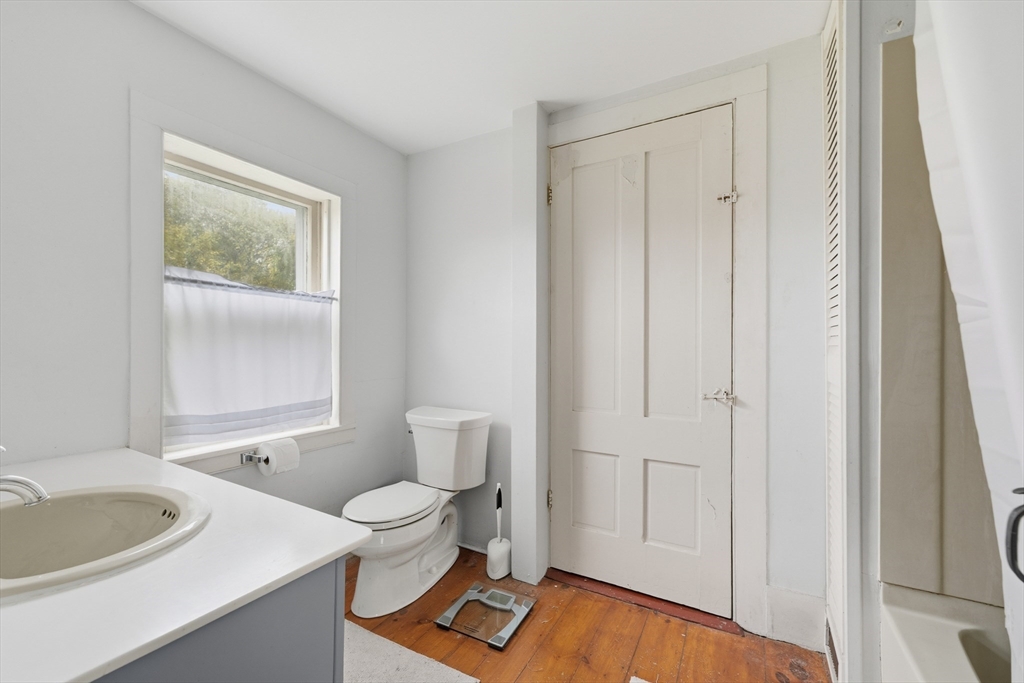 21 Rocky Hill Road Andover, MA 01810 - Photo 16 of 35 a bathroom with a toilet a sink and a mirror