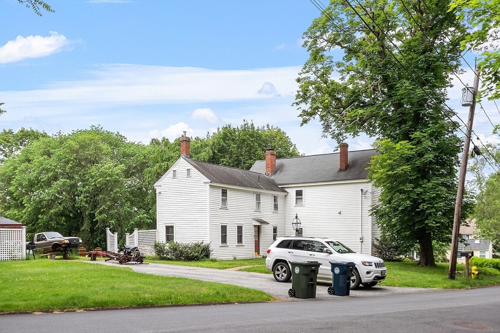 21 Rocky Hill Road Andover, MA 01810 - Photo 22 of 35 a car parked in front of white house