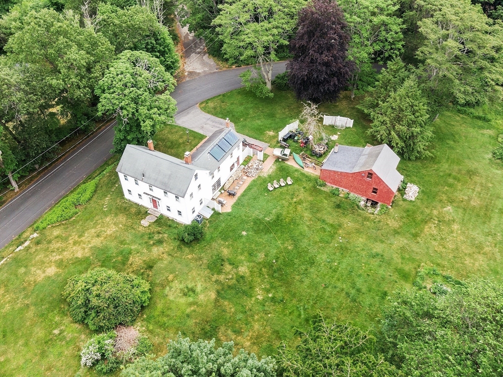 21 Rocky Hill Road Andover, MA 01810 - Photo 29 of 35 a view of a table and chairs in a backyard