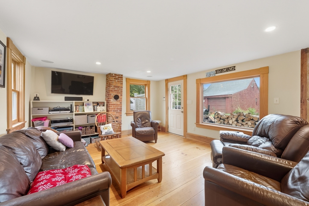 21 Rocky Hill Road Andover, MA 01810 - Photo 5 of 35 a living room with furniture and a flat screen tv