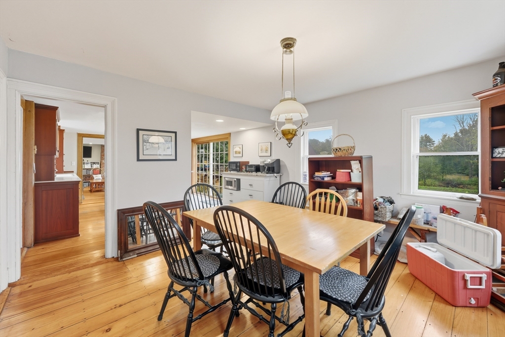 21 Rocky Hill Road Andover, MA 01810 - Photo 10 of 35 a dining room with furniture a chandelier and wooden floor