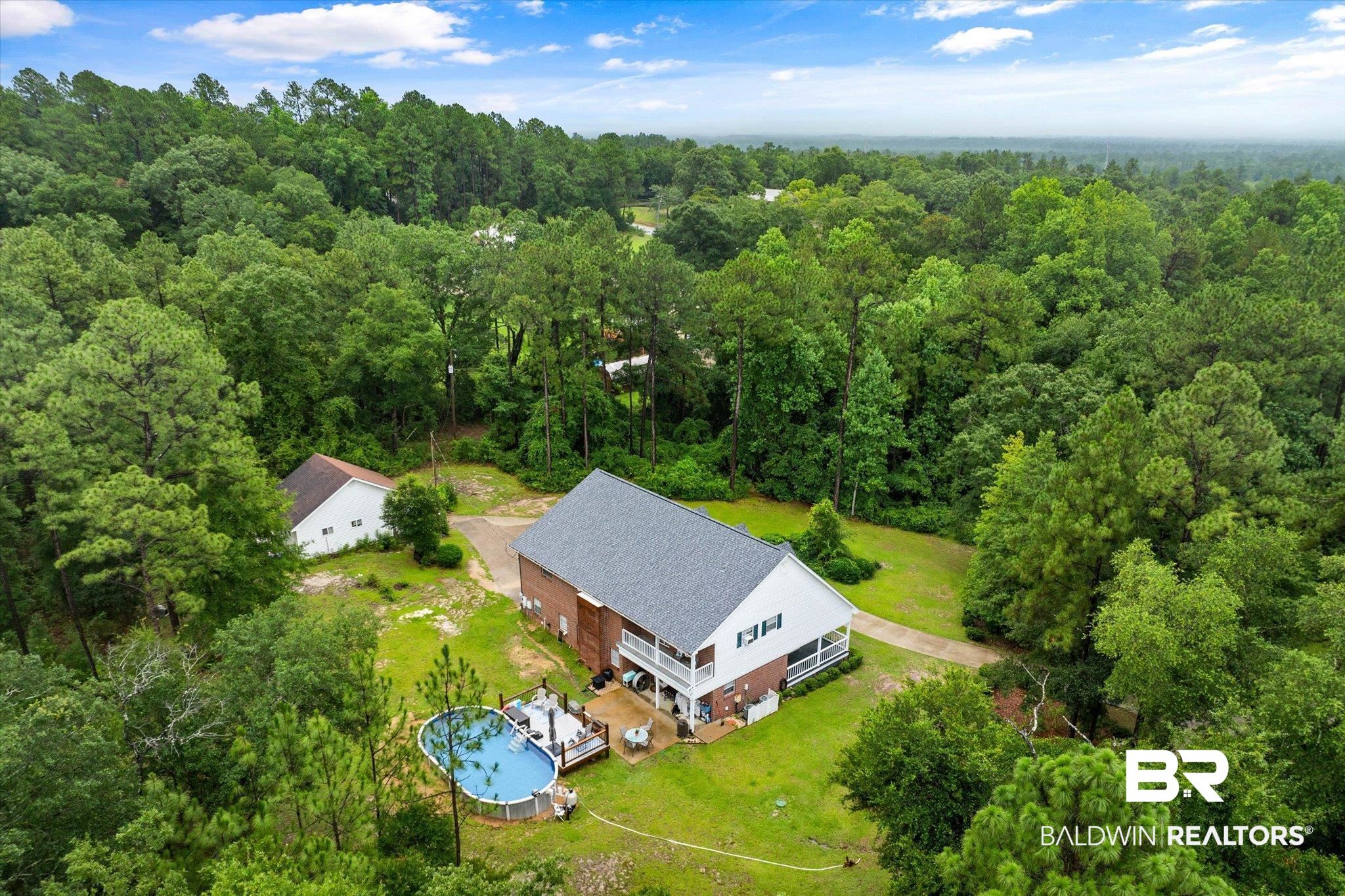 2300 Radcliff Road Saraland, AL 36571 - Photo 38 of 56 Aerial view of property and surrounding area featuring a forest