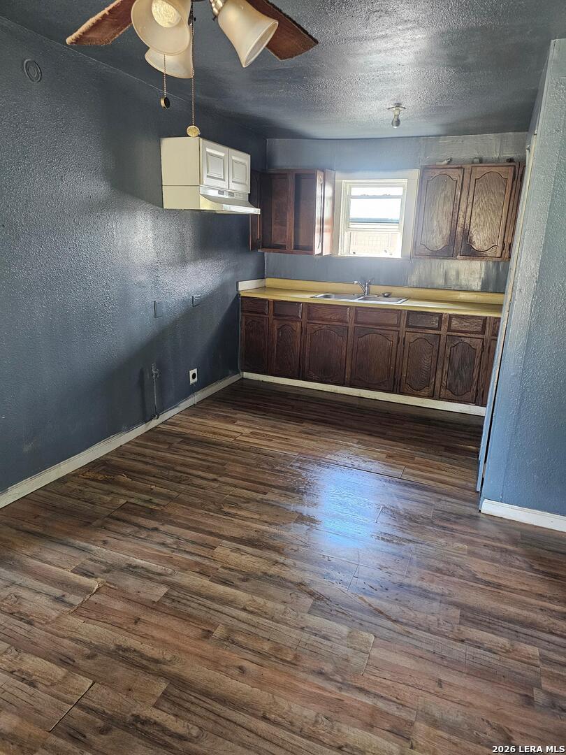 701 Roosevelt Street Longview, TX 75601 - Photo 8 of 8 a view of an empty room with a window and wooden floor