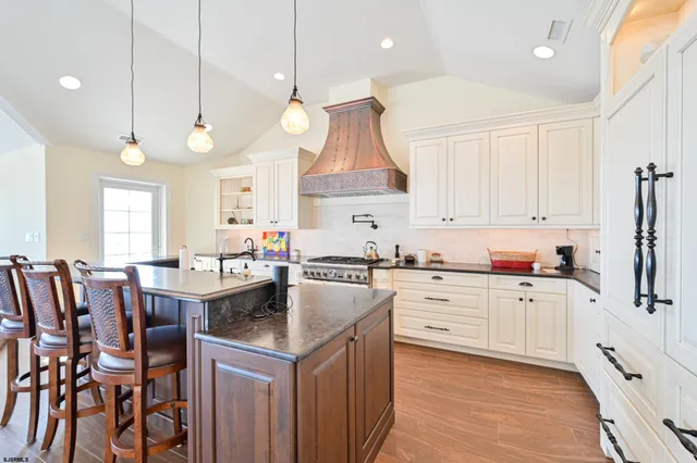 a bathroom with a double vanity sink mirror and
