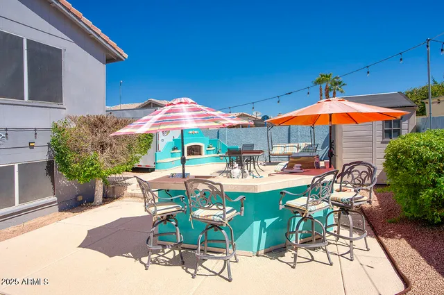 a view of a backyard with couches plants