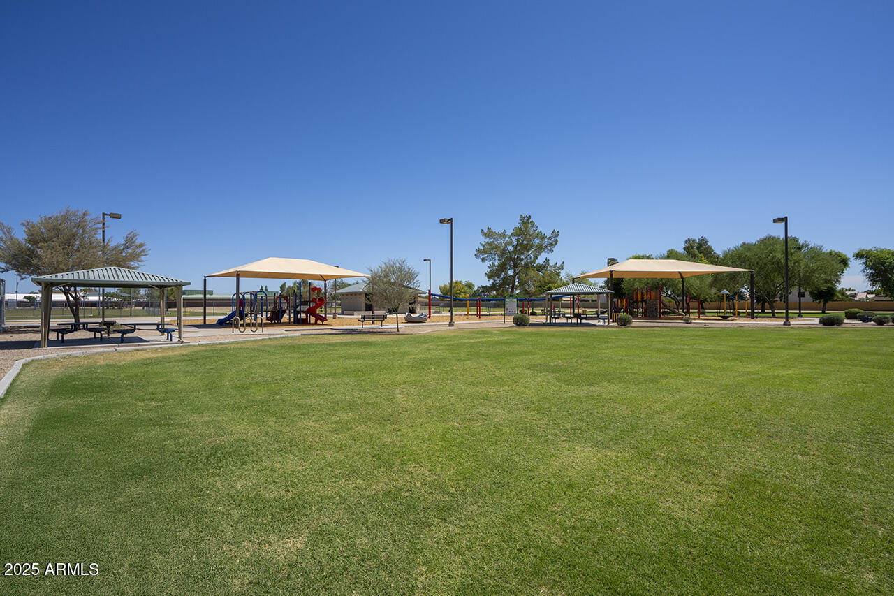 12677 North 77th Drive Peoria, AZ 85381 - Photo 23 of 25 a front view of a house with garden