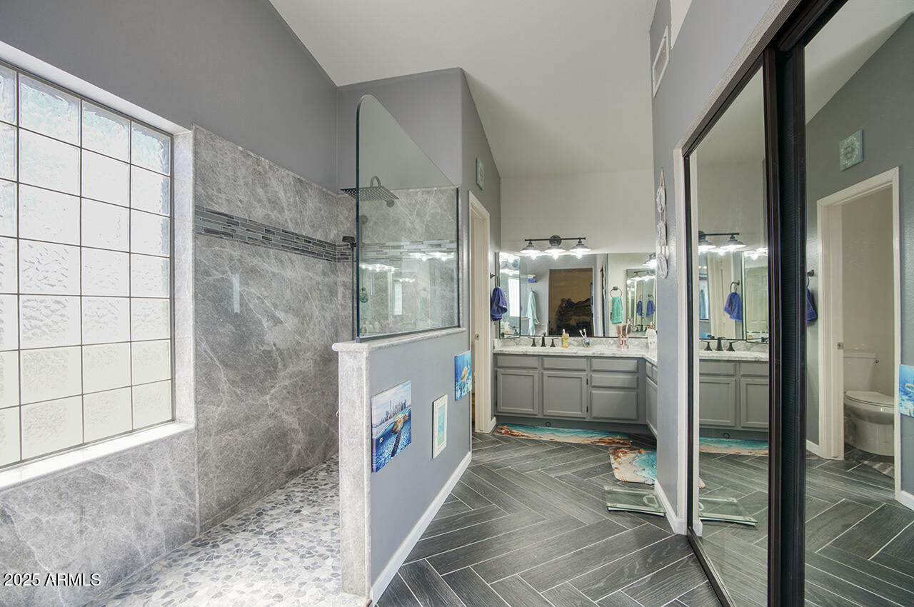 12677 North 77th Drive Peoria, AZ 85381 - Photo 2 of 25 a bathroom with a tub shower and sink