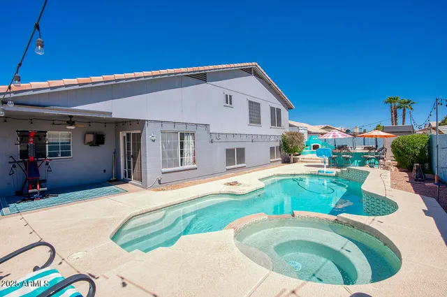 a bathroom with a tub shower and sink