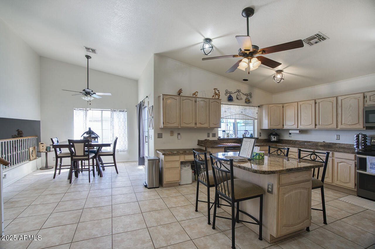 12677 North 77th Drive Peoria, AZ 85381 - Photo 5 of 25 a view of a dining room with furniture