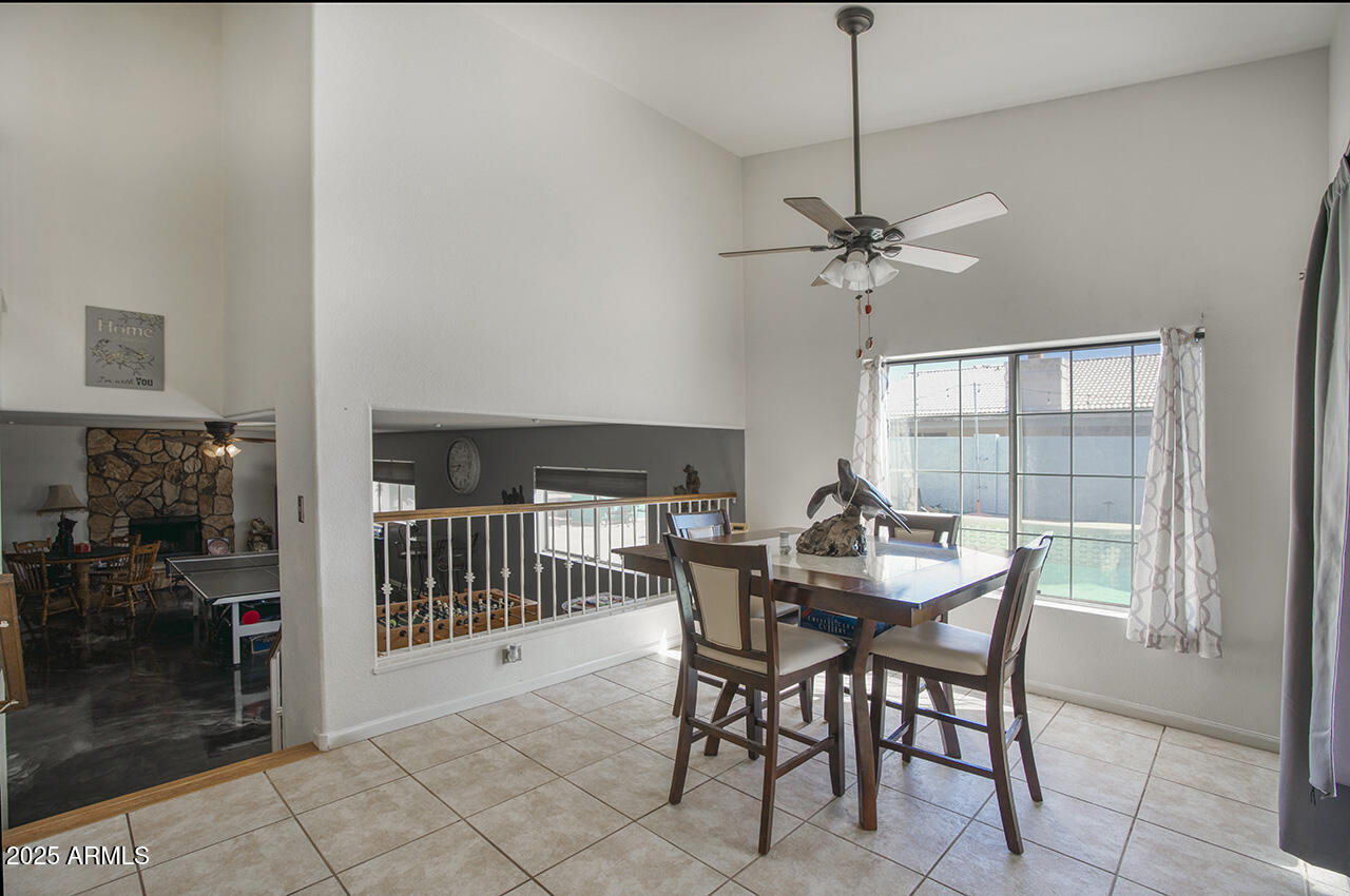 12677 North 77th Drive Peoria, AZ 85381 - Photo 7 of 25 a view of a dining room with furniture